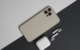 iPhone displaying ads with AirPods on the side, illustrating the impact of iOS privacy updates on advertising.